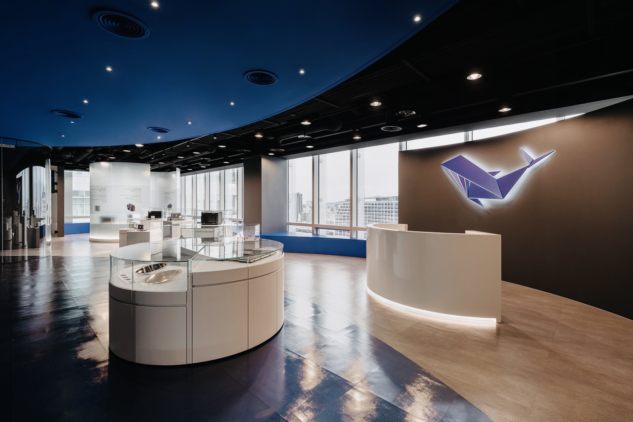 WHALECHIP office reception area with display cases and whale logo wall